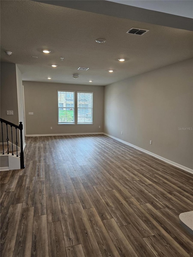 unfurnished room with dark hardwood / wood-style floors