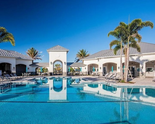 view of swimming pool with a patio area