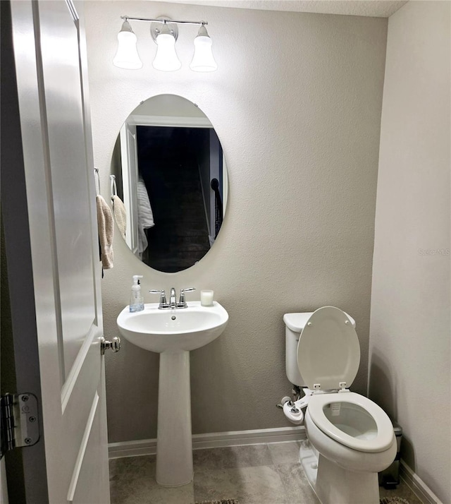 bathroom with sink and toilet