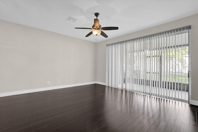 unfurnished room featuring ceiling fan and dark hardwood / wood-style flooring