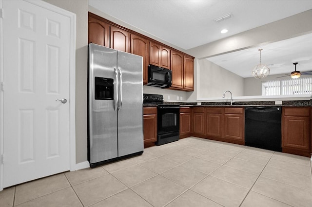 kitchen with light tile patterned floors, pendant lighting, black appliances, ceiling fan, and sink