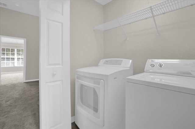 washroom with carpet floors and washing machine and clothes dryer