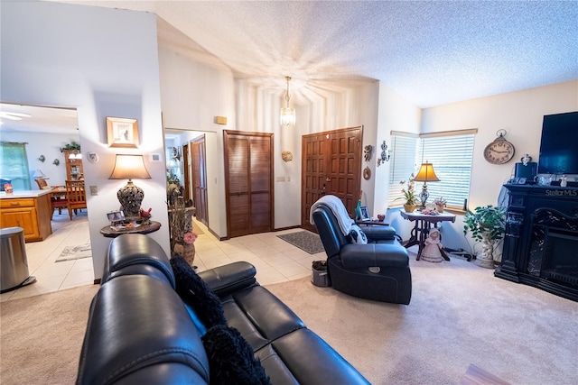 tiled living room with a high ceiling and a textured ceiling