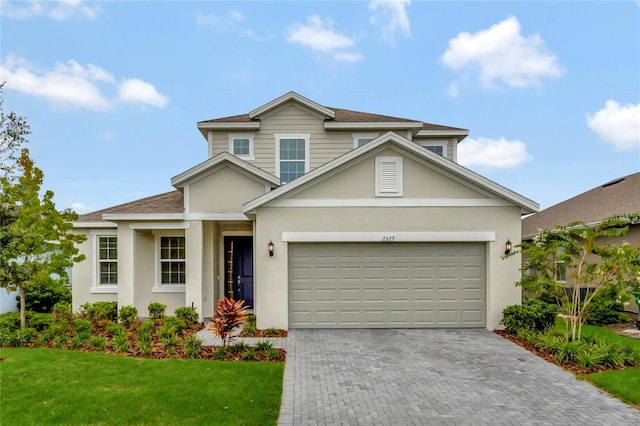 front of property featuring a garage and a front yard