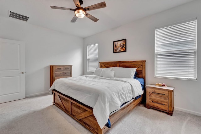 bedroom with ceiling fan and light colored carpet