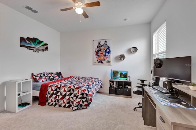 carpeted bedroom featuring ceiling fan