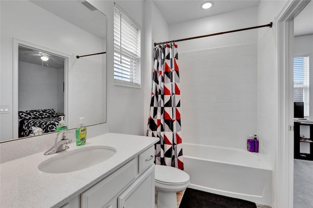 full bathroom featuring shower / tub combo, vanity, and toilet