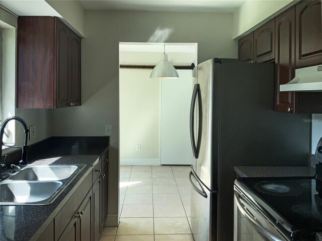 kitchen with dark brown cabinetry, light tile patterned floors, sink, extractor fan, and stainless steel electric stove