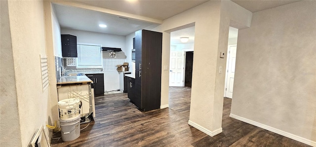 kitchen with dark wood-type flooring