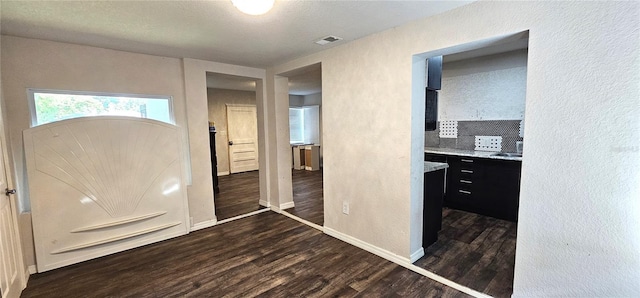 entrance foyer featuring dark hardwood / wood-style floors