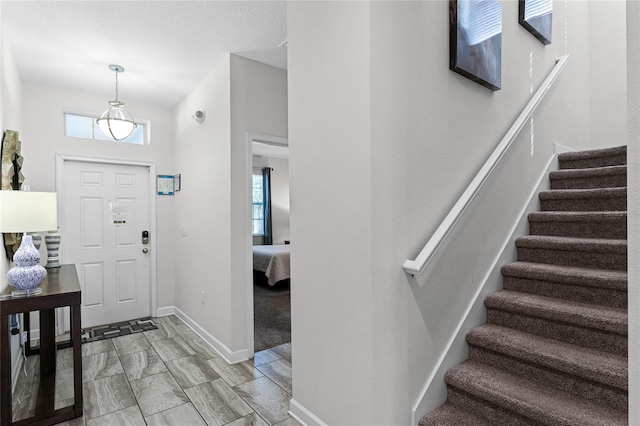 entrance foyer featuring a high ceiling