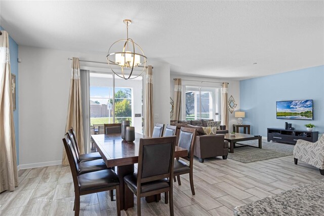 dining area with an inviting chandelier and a healthy amount of sunlight