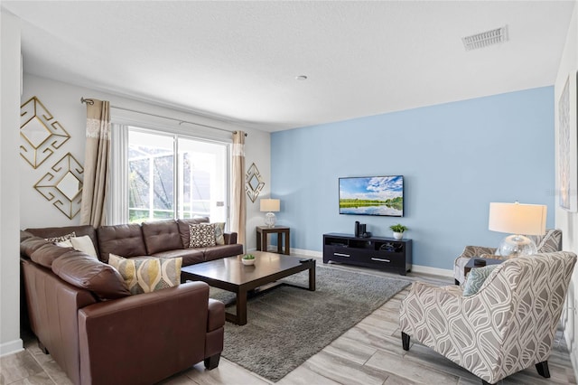 living room with light hardwood / wood-style flooring