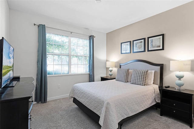 bedroom with light colored carpet