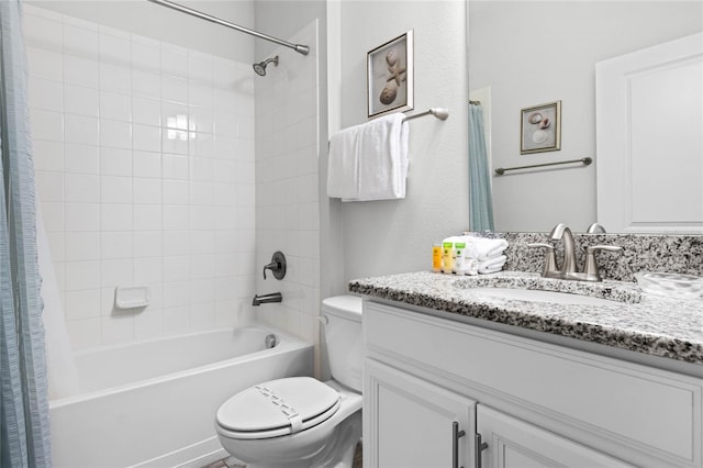 full bathroom featuring toilet, vanity, and shower / tub combo with curtain