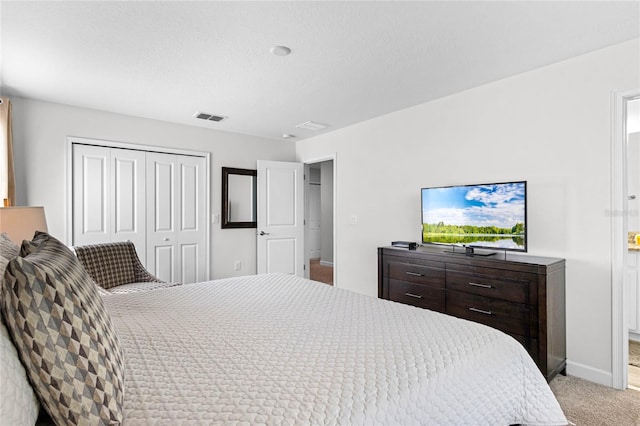 carpeted bedroom with a closet