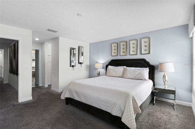 bedroom featuring dark colored carpet