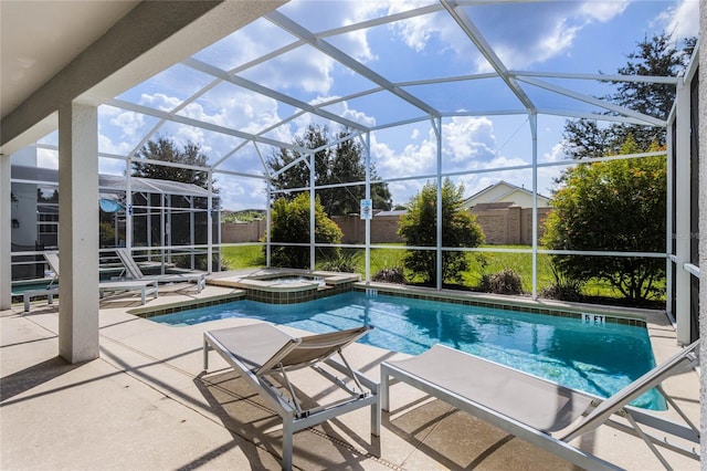 view of pool with an in ground hot tub, a lanai, and a patio