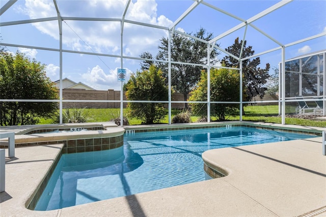 view of swimming pool featuring glass enclosure and a patio area