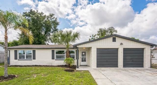 single story home with a garage and a front yard