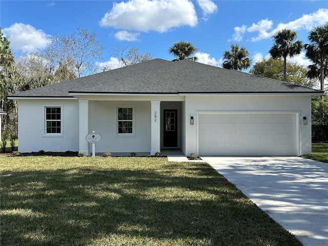 view of front facade featuring a garage and a front lawn