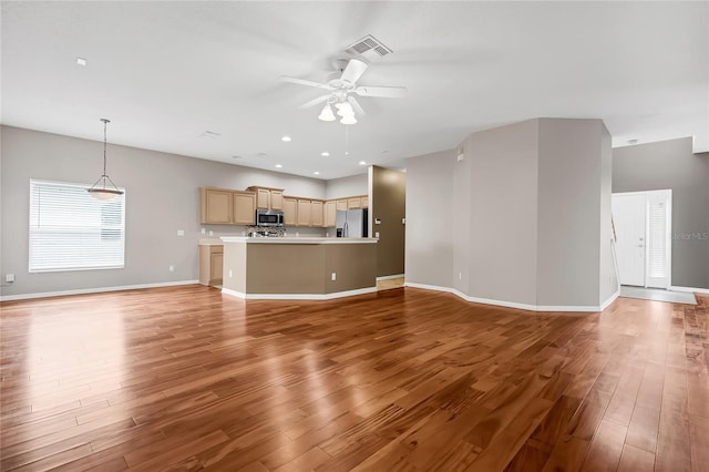 unfurnished living room featuring light wood-type flooring and ceiling fan