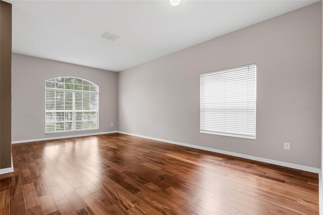 empty room featuring hardwood / wood-style flooring