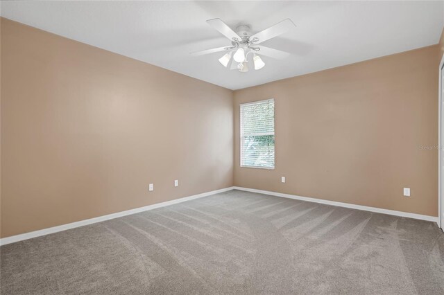 unfurnished room with carpet floors and ceiling fan