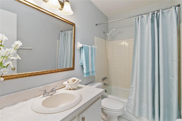 full bathroom featuring shower / bathtub combination with curtain, vanity, and toilet