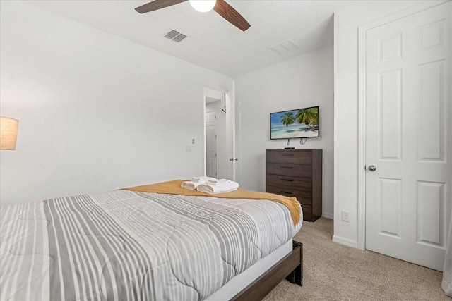 bedroom featuring light colored carpet and ceiling fan