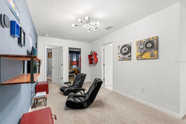 living area with light carpet and a textured ceiling