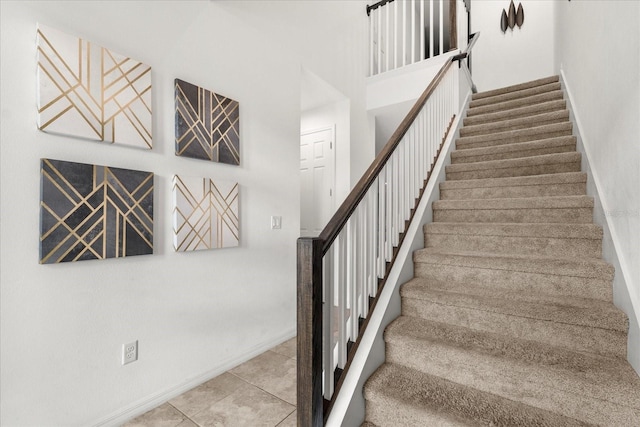 staircase with tile patterned flooring