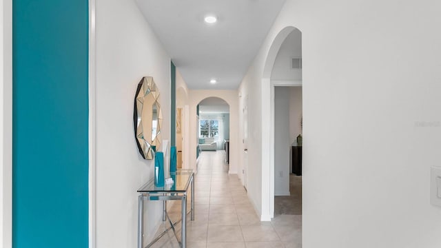 corridor with light tile patterned floors