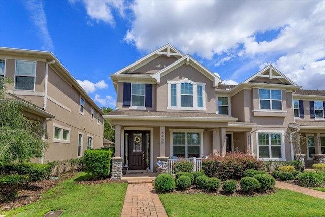 view of front of home featuring a front lawn and covered porch