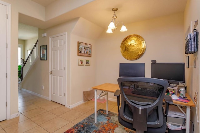 office area with an inviting chandelier, light tile patterned flooring, and baseboards