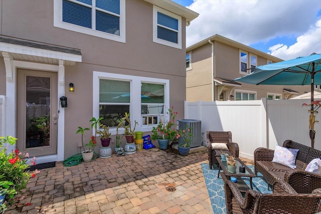 view of patio featuring fence and cooling unit