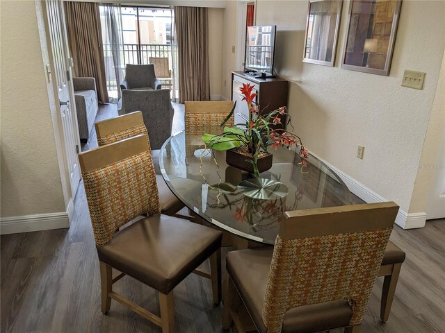 12527 Floridays Resort Dr Unit 510E, Orlando, FL 32821 - dining space featuring hardwood / wood-style floors