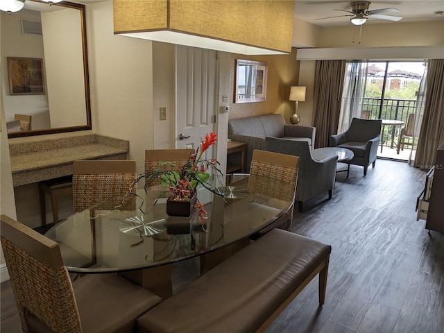 12527 Floridays Resort Dr Unit 510E, Orlando, FL 32821 - dining area featuring wood-type flooring and ceiling fan
