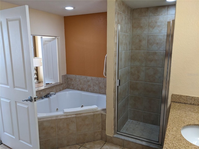 12527 Floridays Resort Dr Unit 510E, Orlando, FL 32821 - bathroom featuring vanity, plus walk in shower, and tile patterned floors