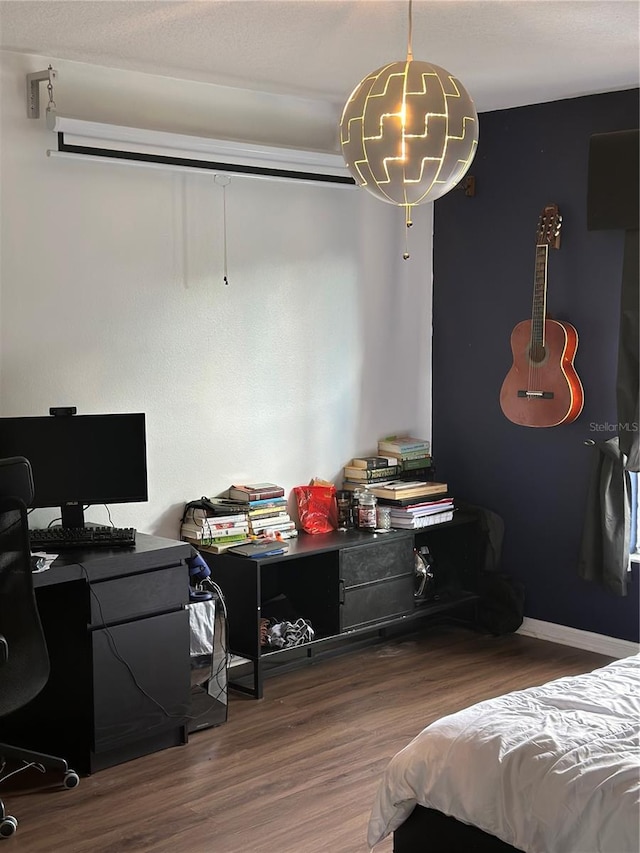 bedroom featuring hardwood / wood-style floors