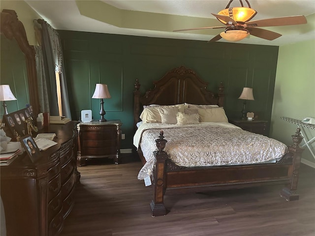 bedroom featuring ceiling fan and dark hardwood / wood-style flooring