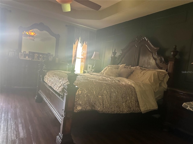 bedroom with hardwood / wood-style floors and ceiling fan