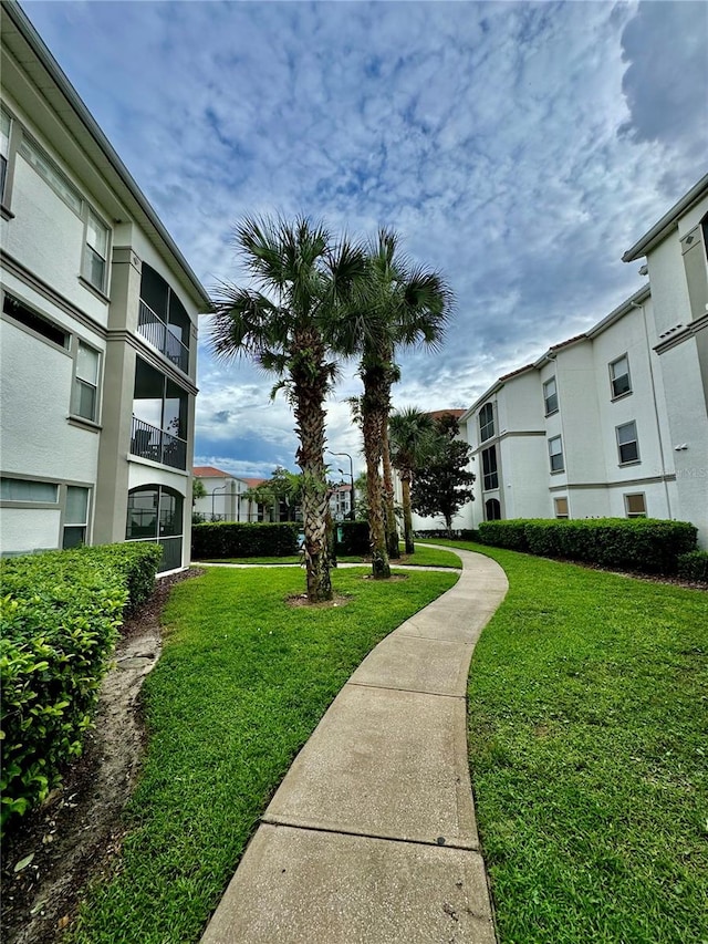 view of home's community featuring a lawn