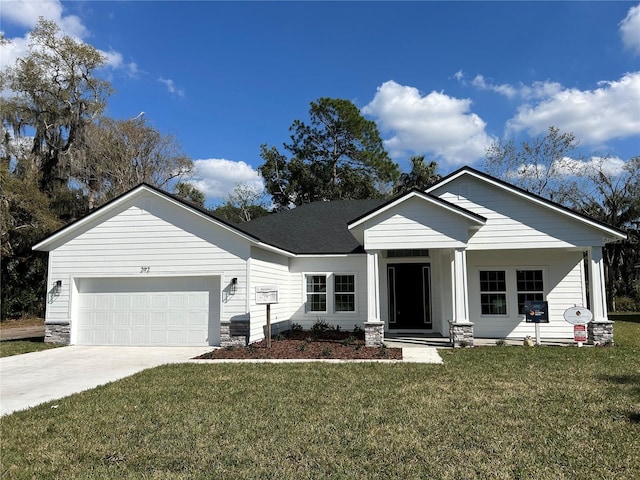 view of front facade featuring a garage and a front lawn