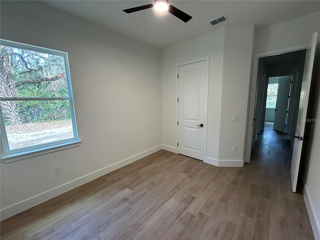 unfurnished bedroom with ceiling fan and light hardwood / wood-style flooring