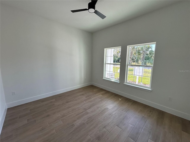 empty room featuring hardwood / wood-style floors and ceiling fan