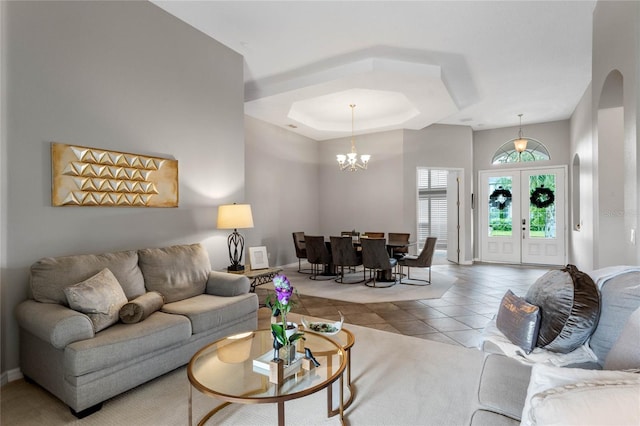 tiled living room with a chandelier