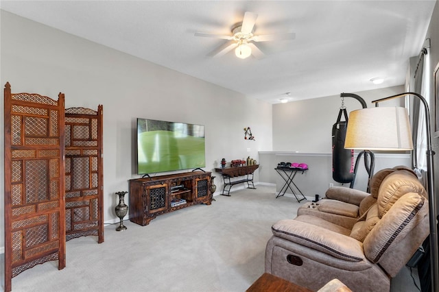 living room featuring light colored carpet and ceiling fan