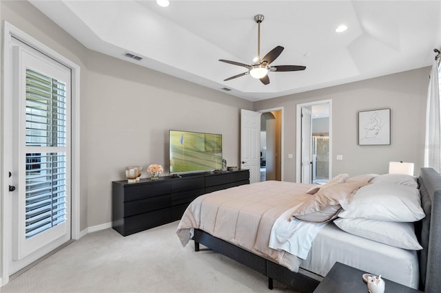 carpeted bedroom with access to outside, ceiling fan, and a tray ceiling