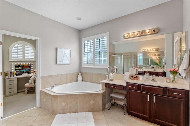 bathroom featuring plenty of natural light, vanity, independent shower and bath, and tile patterned flooring